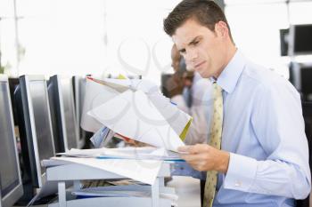 Royalty Free Photo of a Stock Trader With Paperwork
