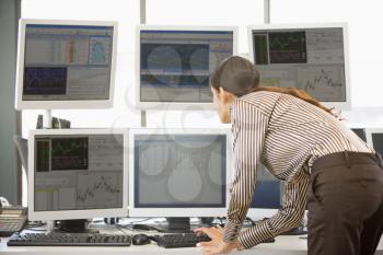 Royalty Free Photo of Stock Trading Computers and a Woman