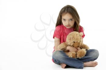 Royalty Free Photo of a Girl With a Teddy Bear