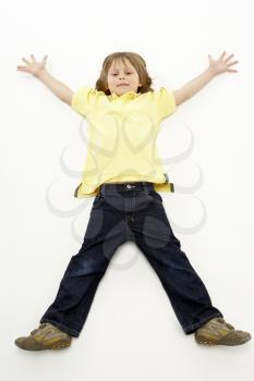 Royalty Free Photo of a Boy With His Arms and Legs Outspread