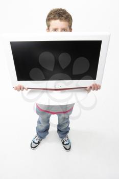 Royalty Free Photo of a Boy Holding a TV