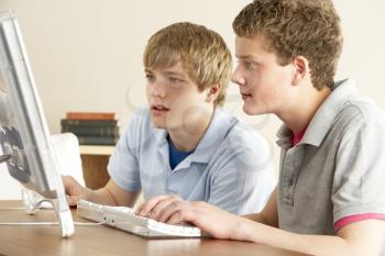 Royalty Free Photo of Two Boys on a Computer