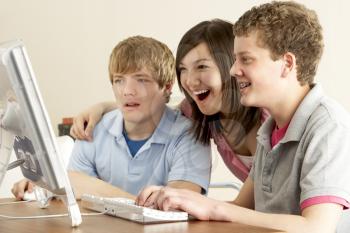 Royalty Free Photo of Teens on a Computer