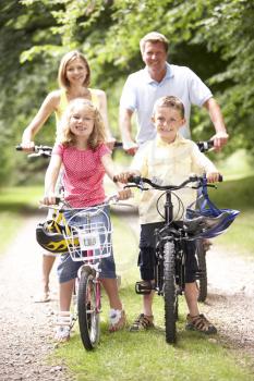 Royalty Free Photo of a Family Riding Bikes