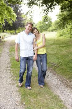 Royalty Free Photo of a Couple Walking on a Trail