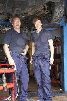 Royalty Free Photo of a Mechanic and Apprentice