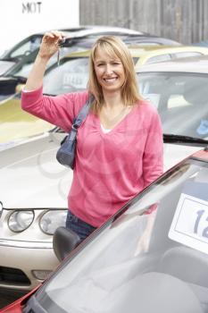 Royalty Free Photo of a Woman With a New Car