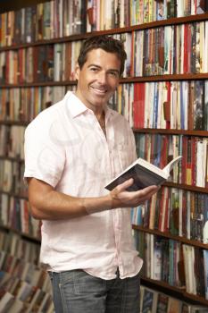 Royalty Free Photo of a Man Looking at Books