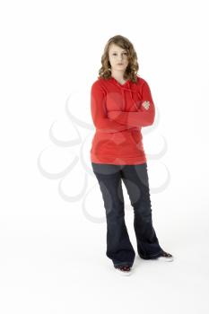 Royalty Free Photo of a Girl Standing With Her Arms Crossed