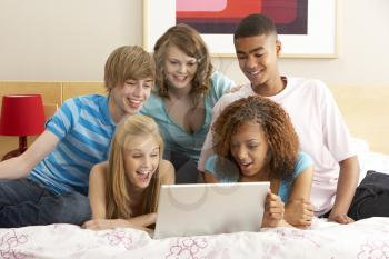 Royalty Free Photo of a Group of Kids With a Laptop