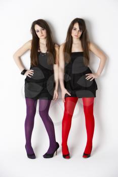 Royalty Free Photo of Two Girls in Coloured Tights