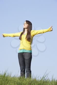 Royalty Free Photo of a Girl Standing Outside