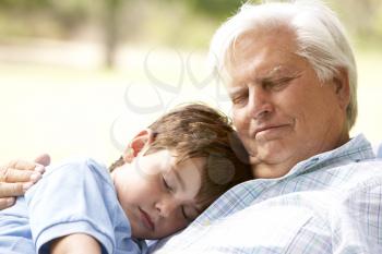 Royalty Free Photo of a Grandfather and Grandson Sleeping