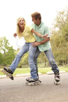 Royalty Free Photo of a Couple Rollerblading