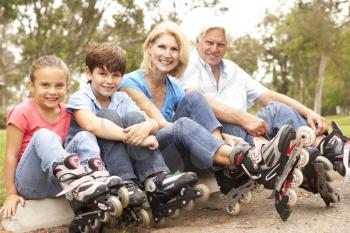 Royalty Free Photo of Children and Grandparents Roller Blading
