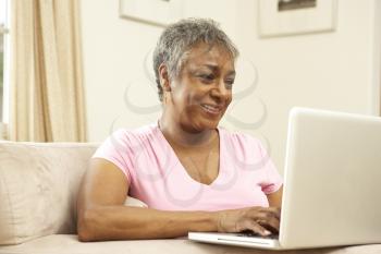 Royalty Free Photo of a Woman With a Laptop