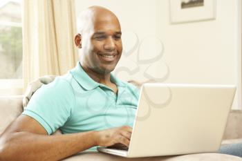 Royalty Free Photo of an African American Man With a Laptop