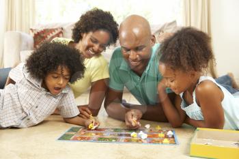 Royalty Free Photo of a Family Playing Games