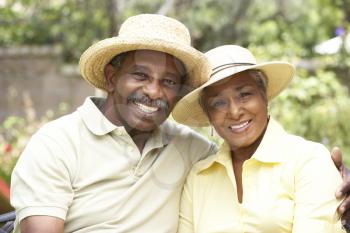 Royalty Free Photo of a Couple Wearing Straw Hats