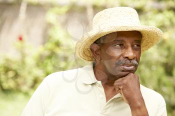 Royalty Free Photo of a Senior Black Man in a Straw Hat