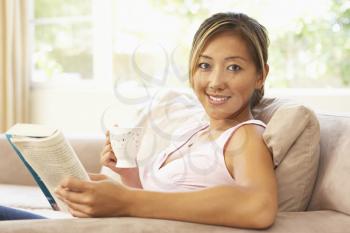 Royalty Free Photo of a Woman Reading a Book