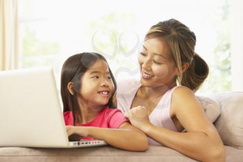Royalty Free Photo of a Mother and Daughter With a Laptop