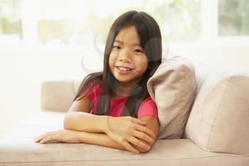 Royalty Free Photo of a Little Girl on a Couch