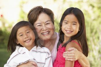 Royalty Free Photo of a Grandmother and Grandchildren