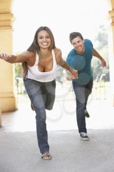 Royalty Free Photo of a Couple Hurrying