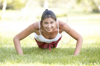 Royalty Free Photo of a Woman Doing Push Ups