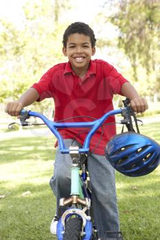 Boy Riding Bike In Park