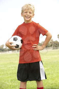 Little Blonde Boy Holding a Soccer Ball