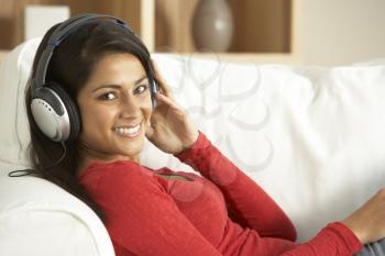 Royalty Free Photo of a Young Woman Listening to Music