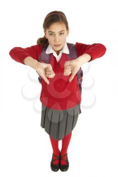Royalty Free Photo of a Girl in a School Uniform Giving Thumbs Down
