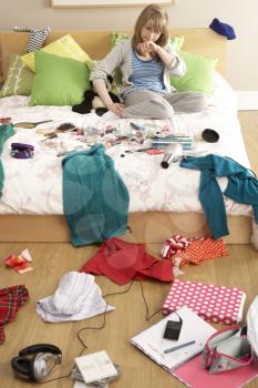 Teenage Girl In Untidy Bedroom