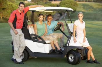 Group Of Friends Riding In Golf Buggy On Golf Course