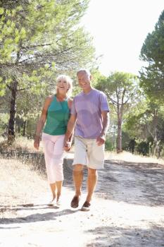 Senior couple, holding hands, walking,walk in park