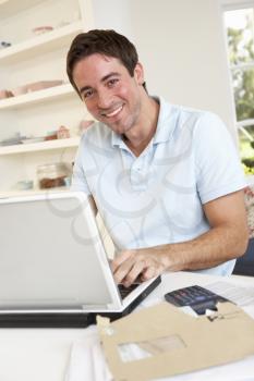 Young man working with laptop computer