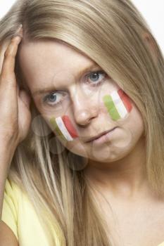 Disappointed Young Female Sports Fan With Italian Flag Painted On Face