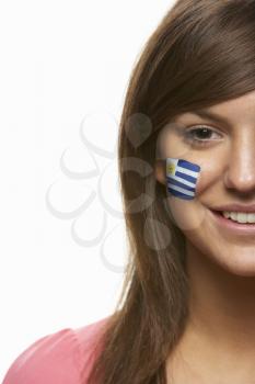 Young Female Sports Fan With Uruguayan Flag Painted On Face