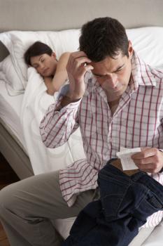 Suspicious Husband Finding Receipt In Wife's Pocket Whilst She Sleeps