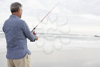 Senior man fishing in sea