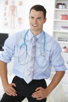 Young male doctor in consulting room