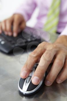 Close up man using  keyboard and mouse