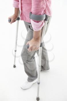 Woman walking with crutches
