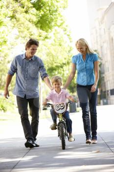 Parents with boy on bike