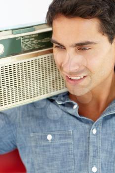 Young man listening to radio