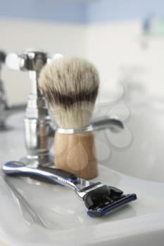 Man's shaving kit in bathroom