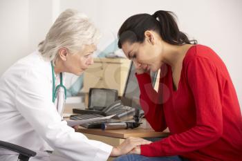 American doctor with depressed woman patient