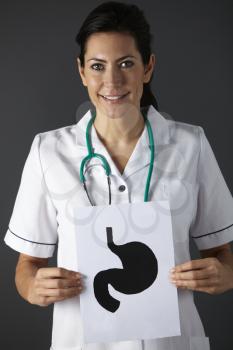 American nurse holding ink drawing of stomach